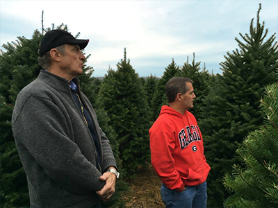 Board member Bob Bailey visits the Valfei tree farm.